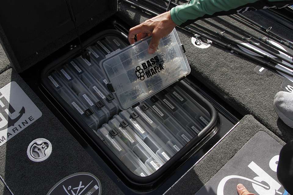 He keeps soft plastics and hooks inside one of his smaller bait compartments.