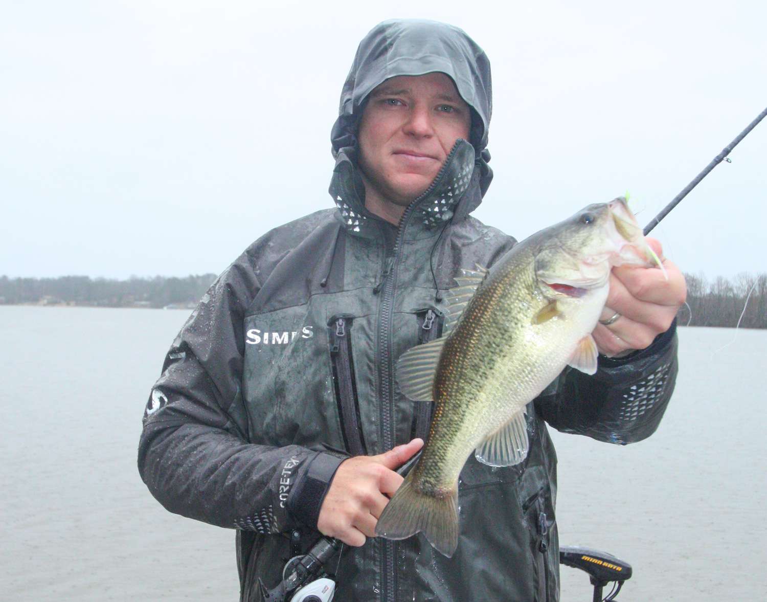 <b>6 HOURS LEFT</b><br>
<b>8 a.m.</b> Frazier moves to a steep Â­tributary bank and casts the spinnerbait, buzzbait and bladed jig around flooded wood cover. <br>
<b>8:15 a.m.</b> Frazier casts the One Knocker to the middle of the creek arm. âThereâs a hump out there with some scattered stumps on it.â <br>
<b>8:22 a.m.</b> He slow rolls a white 1/2-ounce War Eagle spinnerbait across a submerged log at the mouth of the tributary and gets a short strike. <br>
<b>8:24 a.m.</b> Back to the buzzbait. No takers on it yet. <br>
<b>8:26 a.m.</b> Frazier drops his Power-Poles and pitches the jig into a flooded tree branch. 
<b>8:34 a.m.</b> Frazier runs to the extreme upper end of the lake, where muddy water is gushing in via a flooded creek. He casts the chartreuse and white spinnerbait around the flooded backwater. âIâd feel better about this spot if the runoff were warmer than the lake water, but itâs all the same temperature.â <br>
<b>8:40 a.m.</b> Frazier gets a hellacious strike on the bladed jig, but it turns out to be a 10-pound channel catfish! He releases the cat. âThat slimy sucker knocked 3 feet of slack in my line!â <br>
<b>8:51 a.m.</b> Frazier is alternating between the bladed jig and lipless crankbait without success. âThis waterâs totally trashed up here. I donât like cold, fresh, inflowing mud.â
	<p>
<b>5 HOURS LEFT</b><br>
<b>9 a.m.</b> Itâs still pouring rain. Frazier has speed trolled 100 yards downlake to a flooded bank with slightly clearer water. He casts the chartreuse and white spinnerbait to a laydown and catches keeper No. 2, 1 pound, 8 ounces. âLike that big fish, this one hit pretty close to the boat. They seem to be following the lure out from cover.â <br>
<b>9:16 a.m.</b> Frazier idles to a channel bank to try the chartreuse and white spinnerbait and the bladed jig. âTheyâll use a steep bank like this when moving from deep to shallow water.â <br>
<b>9:25 a.m.</b> Frazier runs straight across the lake to hit a series of shallow âpocketsâ (shoreline indentations) with his lure arsenal. âThe lakeâs rising way back into the woods. The bass could be anywhere.â <br>
<b>9:36 a.m.</b> Frazier combs a flooded fence with the white spinnerbait but hauls water. âCome on, bass, youâre supposed to be holding tight to cover!â <br>
<b>9:48 a.m.</b> Frazier casts the bladed jig to a flooded duck blind on a shallow point. The rain has let up some, but the wind has picked up and itâs noticeably colder. âI need to put five fish in the boat fast! Itâll get even tougher once that cold front blows through.â
<p>
<b>4 HOURS LEFT</b><br>
<b>10 a.m.</b> A fish taps the white spinnerbait near a submerged tree but doesnât hook up. <br>
<b>10:10 a.m.</b> The rain has stopped. Frazier makes a high-speed run down lake to a small island, where he casts the chartreuse and white spinnerbait to a tangle of flooded branches.
