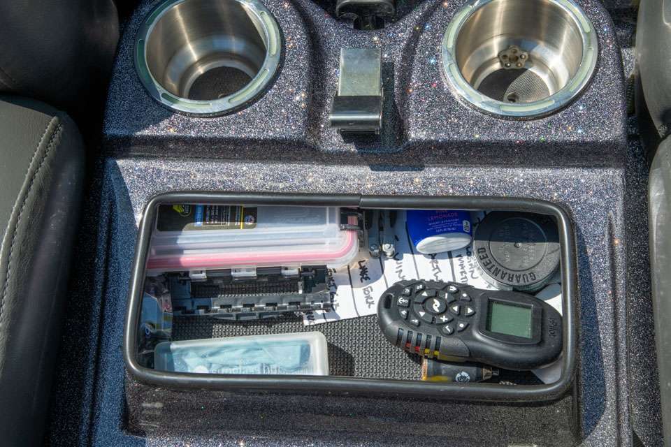 This step also includes a storage compartment that holds a scale, his keys and miscellaneous items.