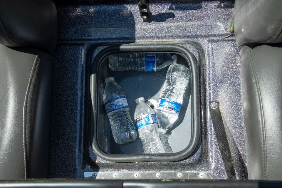 Beneath the step/cup holders is an ice chest.