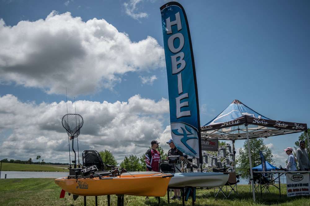 The Hobie Mirage Passporst 10.5 and the Hobie Pro Angler 14 sit side by side at the Texas Fest at Lake Fork, attracting a lot of attention from outdoor enthusiasts.     