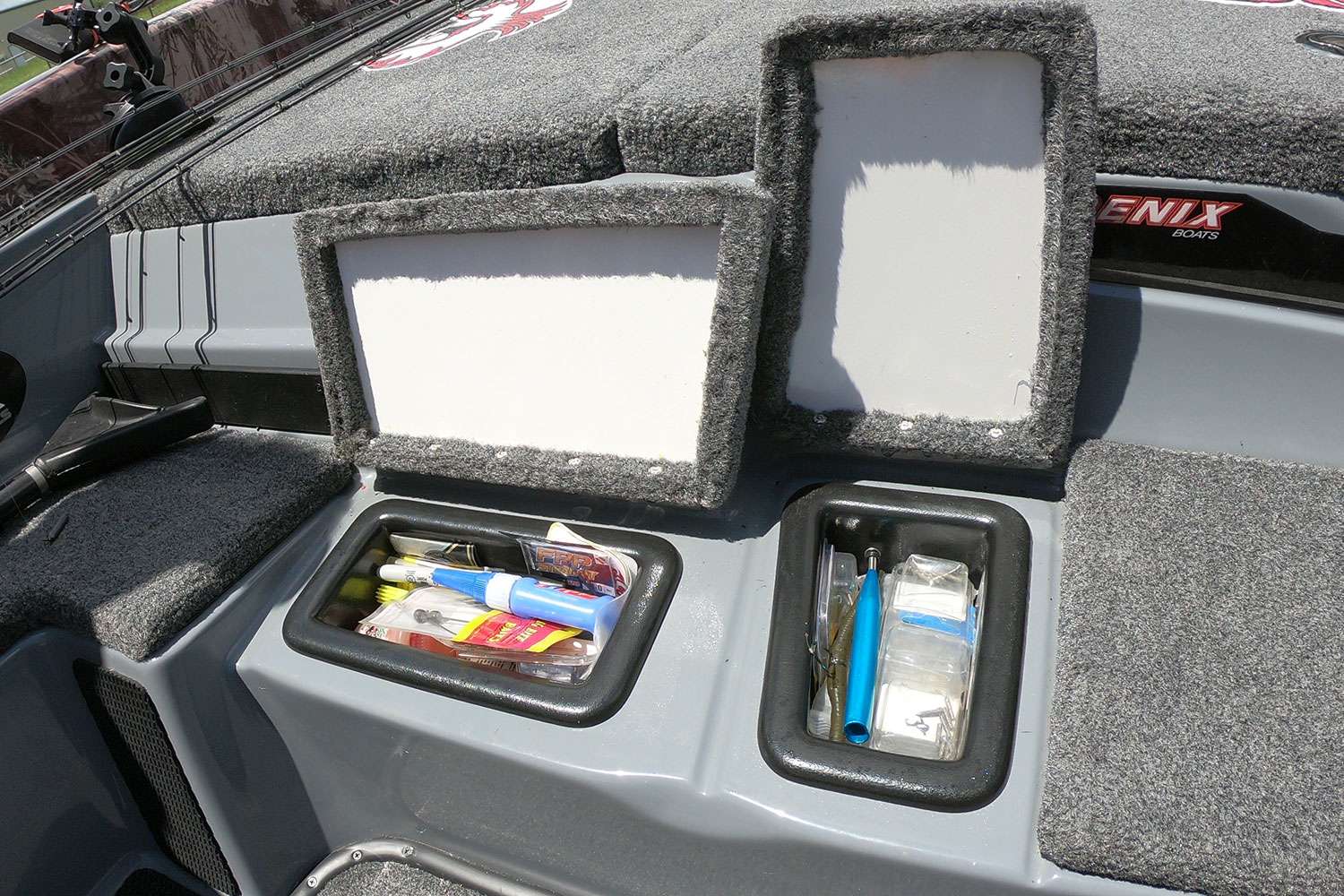 As you step down into his cockpit, these two storage compartments are ultra handy for the small things that don't often have a regular home. 
