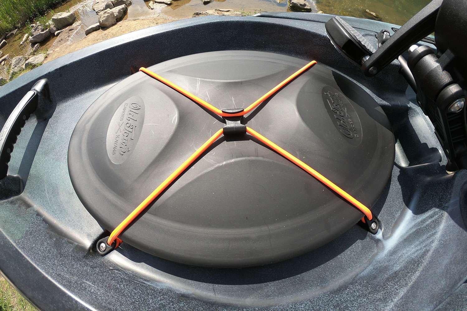 The hatch is held closed with two bungee cords that can be disconnected with one hand. 