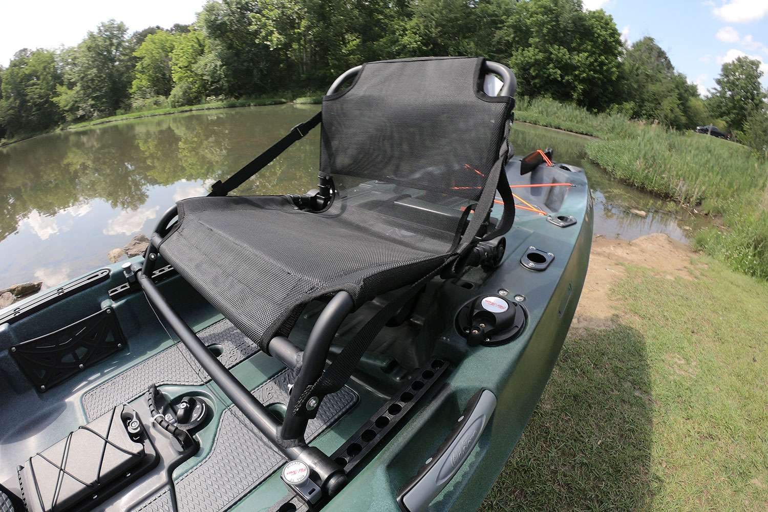 The seat folds down when traveling from lake to lake, but it quickly sits up.