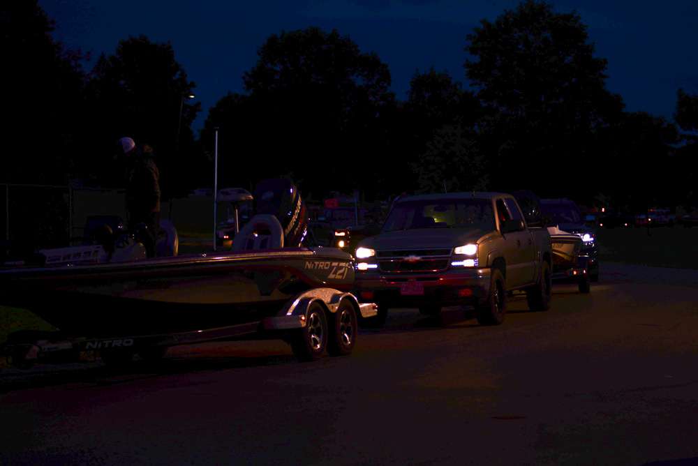 Boats begin to file in well before sunrise.