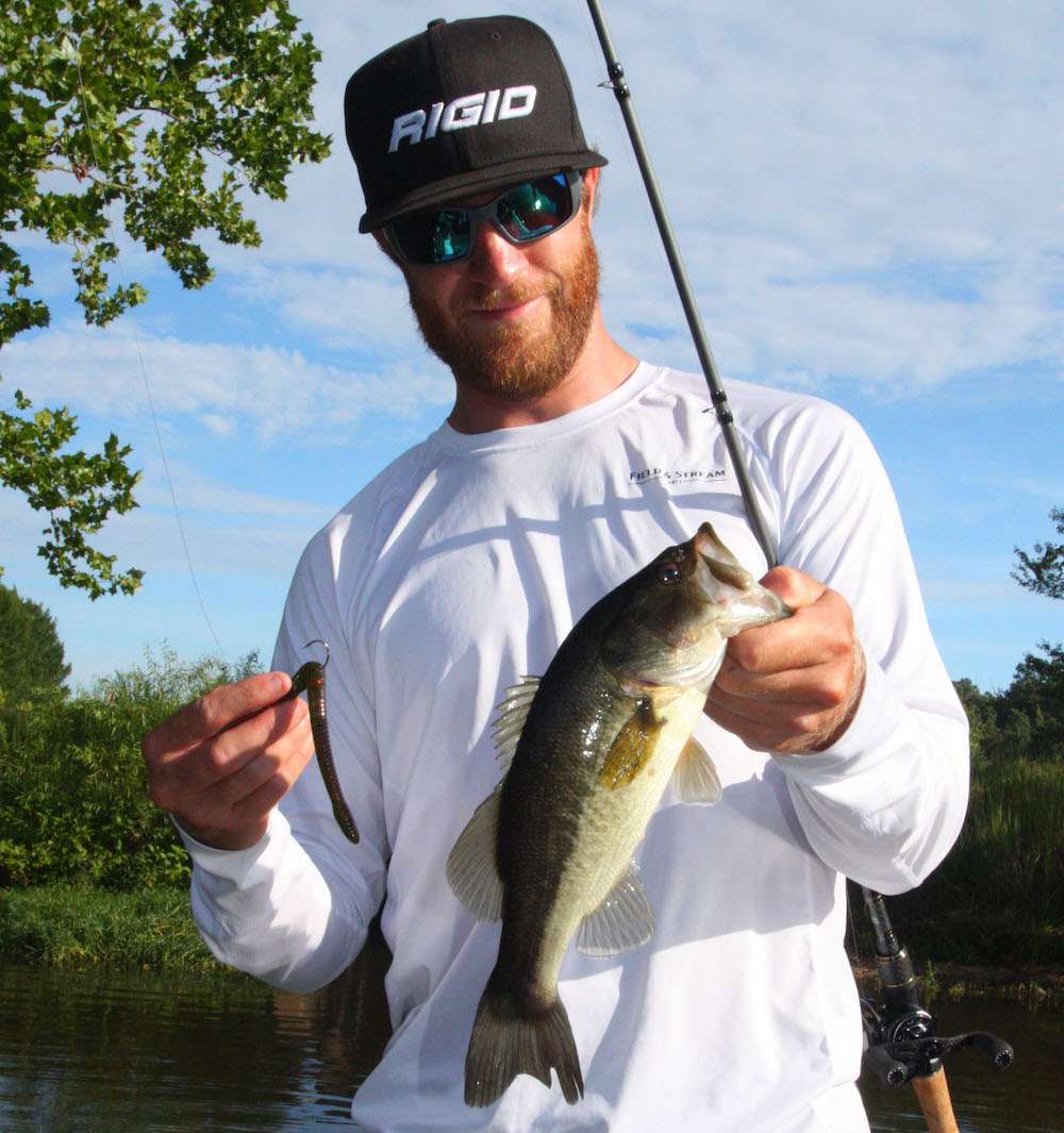 <b>8:20 a.m.</b> Shryock bags his first keeper bass of the day, a 1-pound, 1-ounce largemouth, from the ditch on the shaky head worm. âAs hot as itâs been, even the slightest inflow of fresh, oxygenated water can attract bass.â <br>
<b>8:24 a.m.</b> The light breeze that had been blowing has stopped, and itâs getting hot. Shryockâs shaky head dredges up a wad of old fishing line. <br>
<b>8:35 a.m.</b> Shryock runs back downlake to fish laydowns on a channel bank with the shaky head worm. âThis lure comes through wood cover surprisingly well, and itâs something bass probably havenât seen before.â
<p>
<b>5 HOURS LEFT</B><br>
<b>8:45 a.m.</b> A short trek farther downlake brings Shryock to a shoreline pocket studded with submerged timber, where he catches a short fish on the shaky head worm. <br>
<b>8:54 a.m.</b> Shryock runs across the lake to a channel bank. He skips the shaky head worm beneath a dock and bags another nonkeeper. <br>
<b>8:58 a.m.</b> Shryock makes another cast with the shaky head and suffers a âprofessional overrunâ in his baitcasting reel. He partially clears the tangle, only to discover a big knot in his line. âThatâs what happens when you respool with fresh fluorocarbon three weeks ago and donât use the reel until today.â <br>
<b>9:04 a.m.</b> Shryock finally picks apart the knot and is back in action, hitting docks.
<b>9:10 a.m.</b> He casts the shaky head worm to a seawall. âI like structures close to deep water in summer. Itâs 20 feet deep a cast from this wall.â <br>
<b>9:20 a.m.</b> Shryock switches Dredger crankbait models to a shallower-running 10.5 and retrieves it parallel to the seawall. <br>
<b>9:26 a.m.</b> He probes a brushpile he graphed in 10 feet of water with the shaky head worm. 
