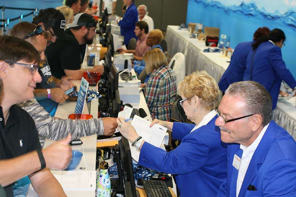 The American Sportfishing Association runs the event, which brings people from all over the globe. Here, some of the 14,500 buyers, media and exhibitors get their credentials to the industry-only event.