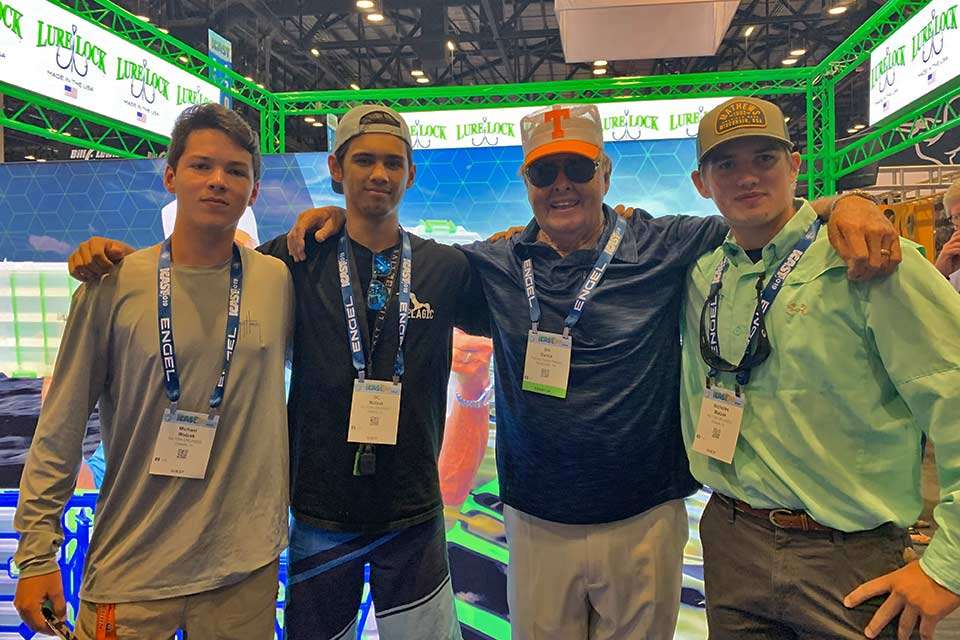 These three young men waited a bit for Bill Dance to end a business meeting so they could get a shot with their favorite TV angler.
