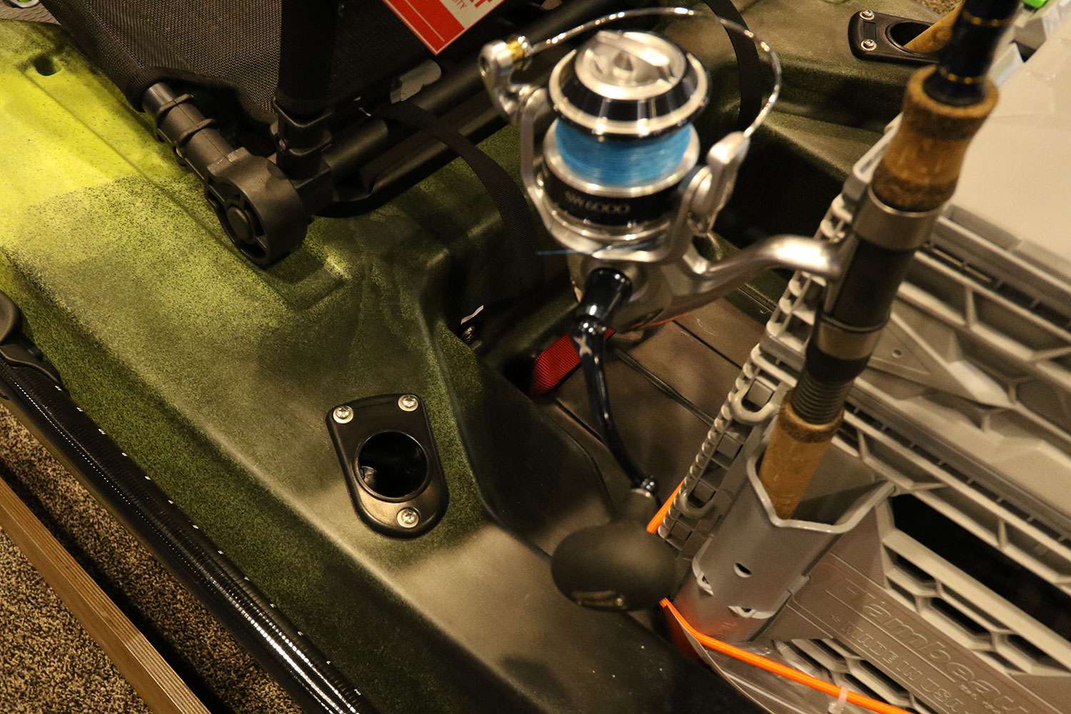 Rod holders are built-in on the Flambeau box, and those compliment the rod holders that come standard with the kayak.
