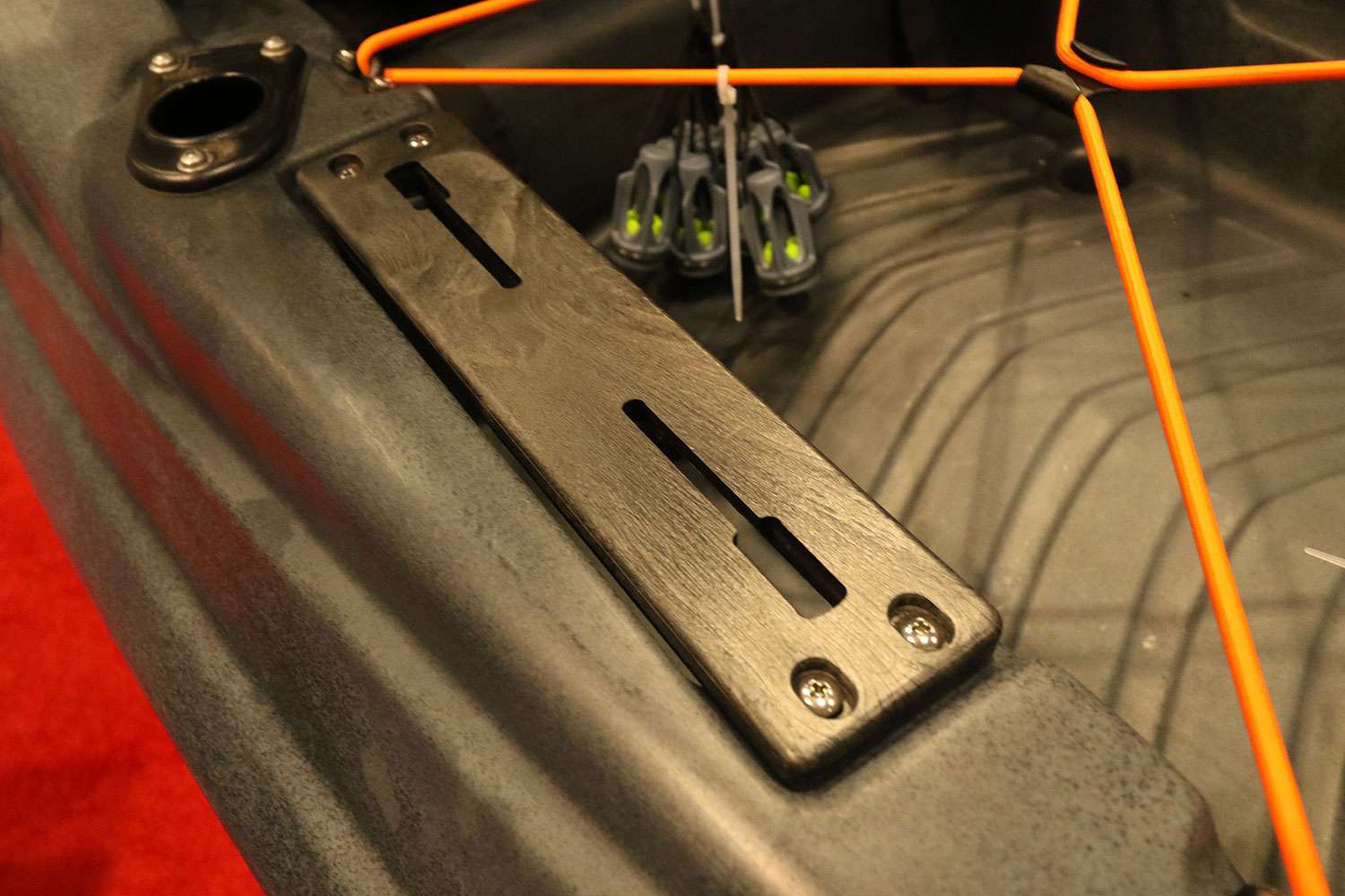 The accessory plates now feature a built-in slot that will hold a number of accessory adapters. There's no longer a need to install additional gear tracks. They are positioned on either side in both the front and rear of the kayak. 
