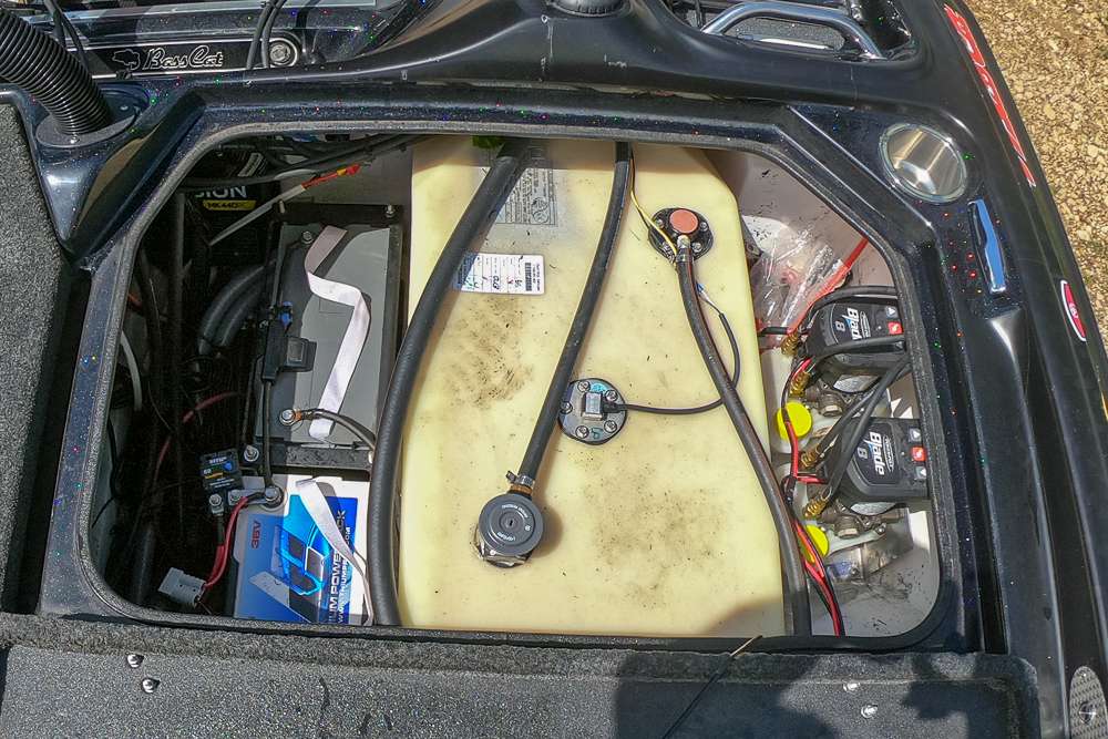 Two 36 volt Lithium Pros batteries sit next to his fuel tank. The lithium batteries save him 190 pounds on the back of the boat. 