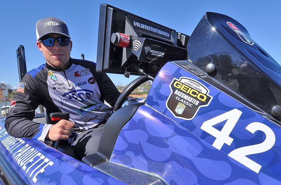 He mans the pilot seat of his bass rig. The 42 on the console was his boat number at the 2019 Bassmaster Classic.