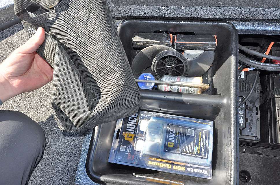 This removable tray holds a spare fish bag, G-Juice for the livewells, a spare prop for the trolling motor and an air horn.