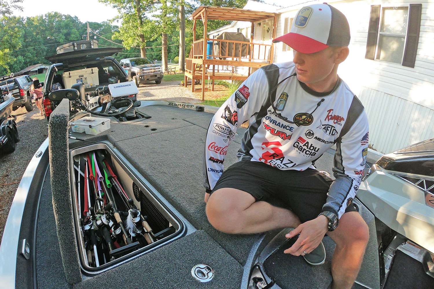 Moving to the port-side rod locker, Frazier grabs a couple of his favorite rod-and-reel combos.