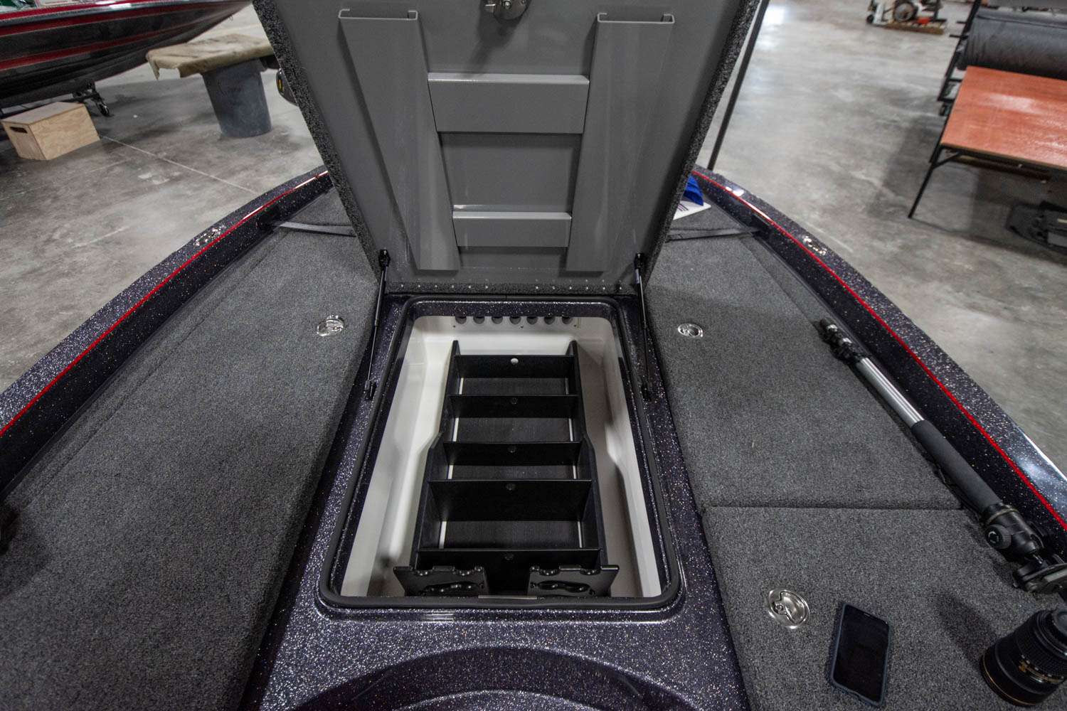 The huge center compartment has adjustable segmented areas for tackle storage, as well as another area to store rods.
