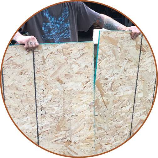 Cut your OSB into two identically sized sections for easy installation on top of the two-by-fours.
