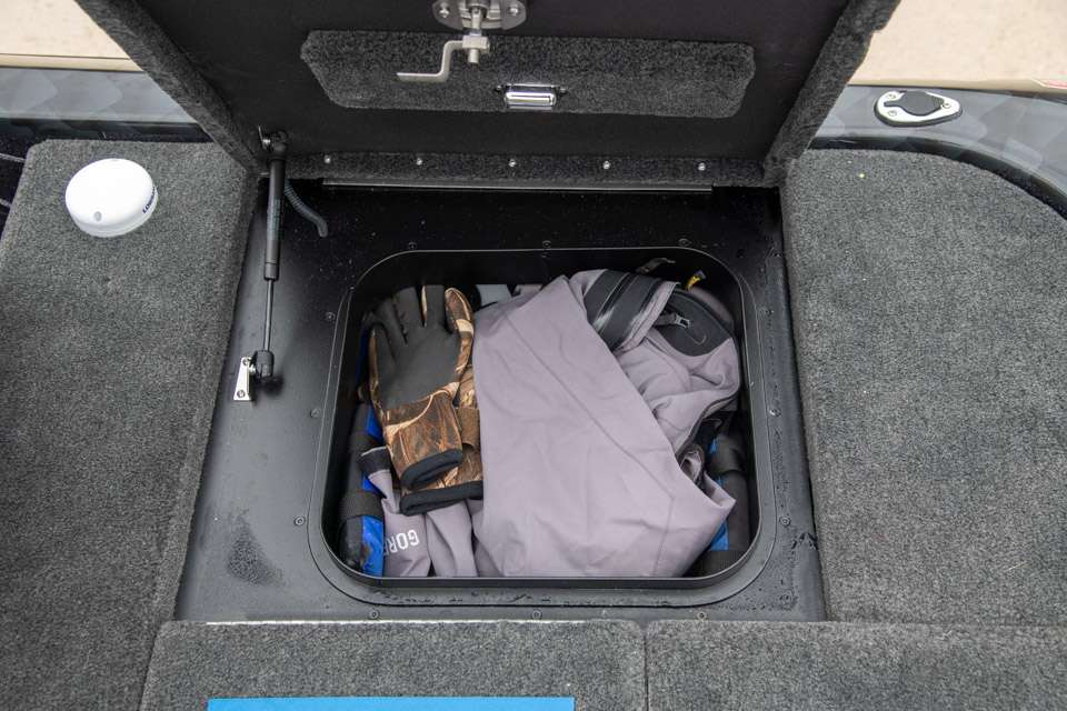 A large rear-deck storage box is used to keep his rain gear handy in case storms roll in.