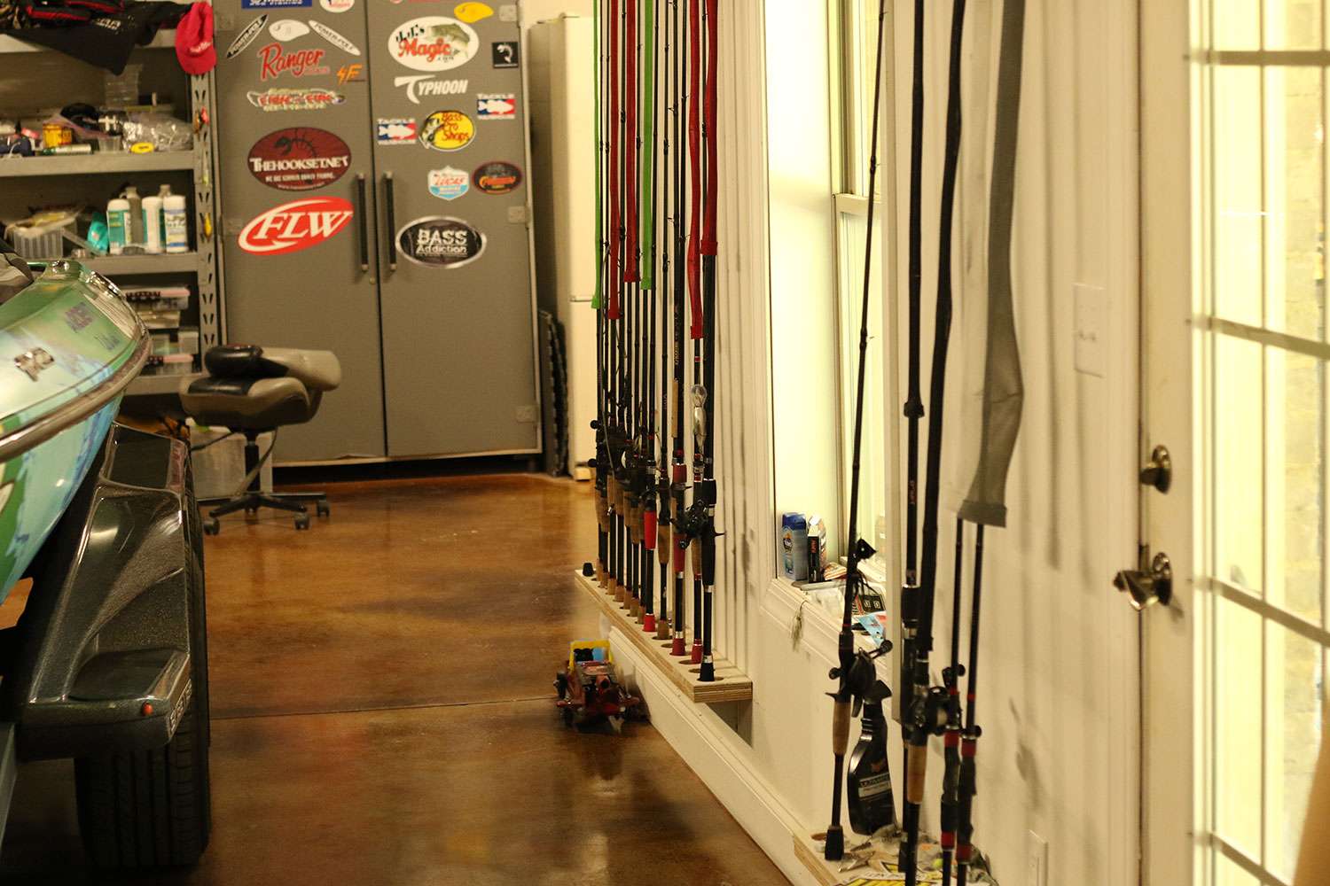 Another look down the wall of his tackle and boat storage room. 