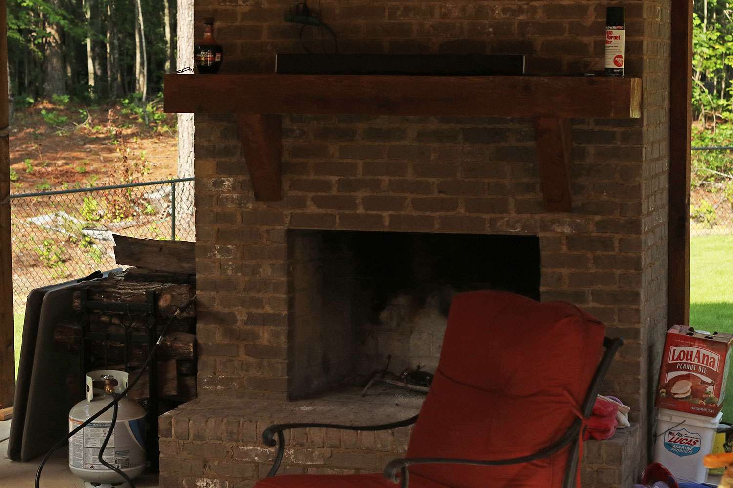 The outdoor fireplace gets lit once the temperatures cool down.
