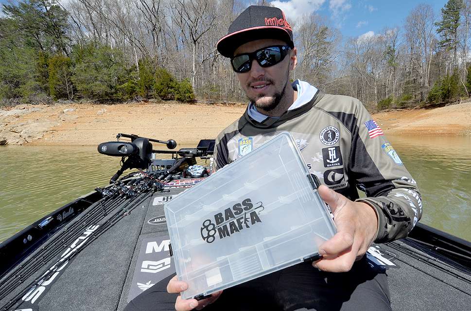 Elite Series pro Carl Jocumsen moved from Australia to Texas to pursue his bass fishing dreams. He learned his craft quickly and will use this knowledge to fill the flat box he is holding with a solid assortment of lures for novice anglers.