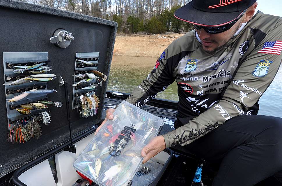 Jocumsen fetches a tackle box filled with lipless crankbaits from his boat locker.