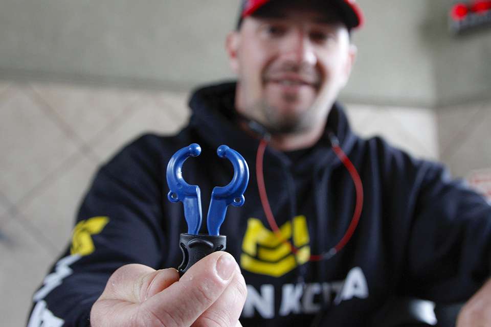 He shows off the T-H Marine Conservation cull clips that are non-penetrating.