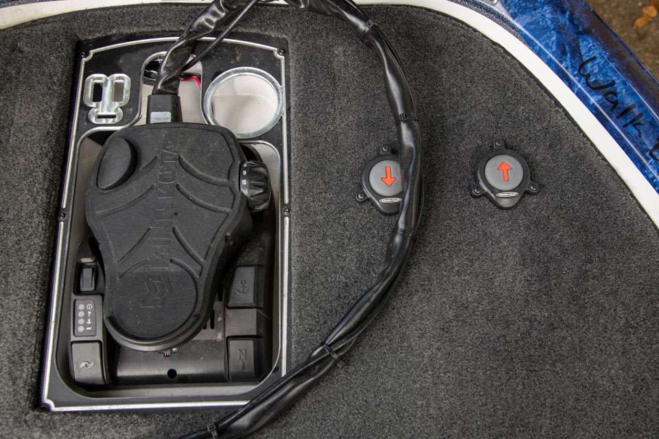 A recessed trolling motor foot peddle allows easy, comfortable control. His Power-Pole controls also are located just to the right so he can quickly stop the boat when working shallow-water fish. Note the slots near the pedal for pliers and a cup holder for water.