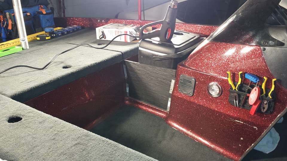 One final touch that I made was to apply carpet trim to the visible edges of the boat. However, applying trim in the Midwest during the middle of winter requires heat lamps and a heat gun.