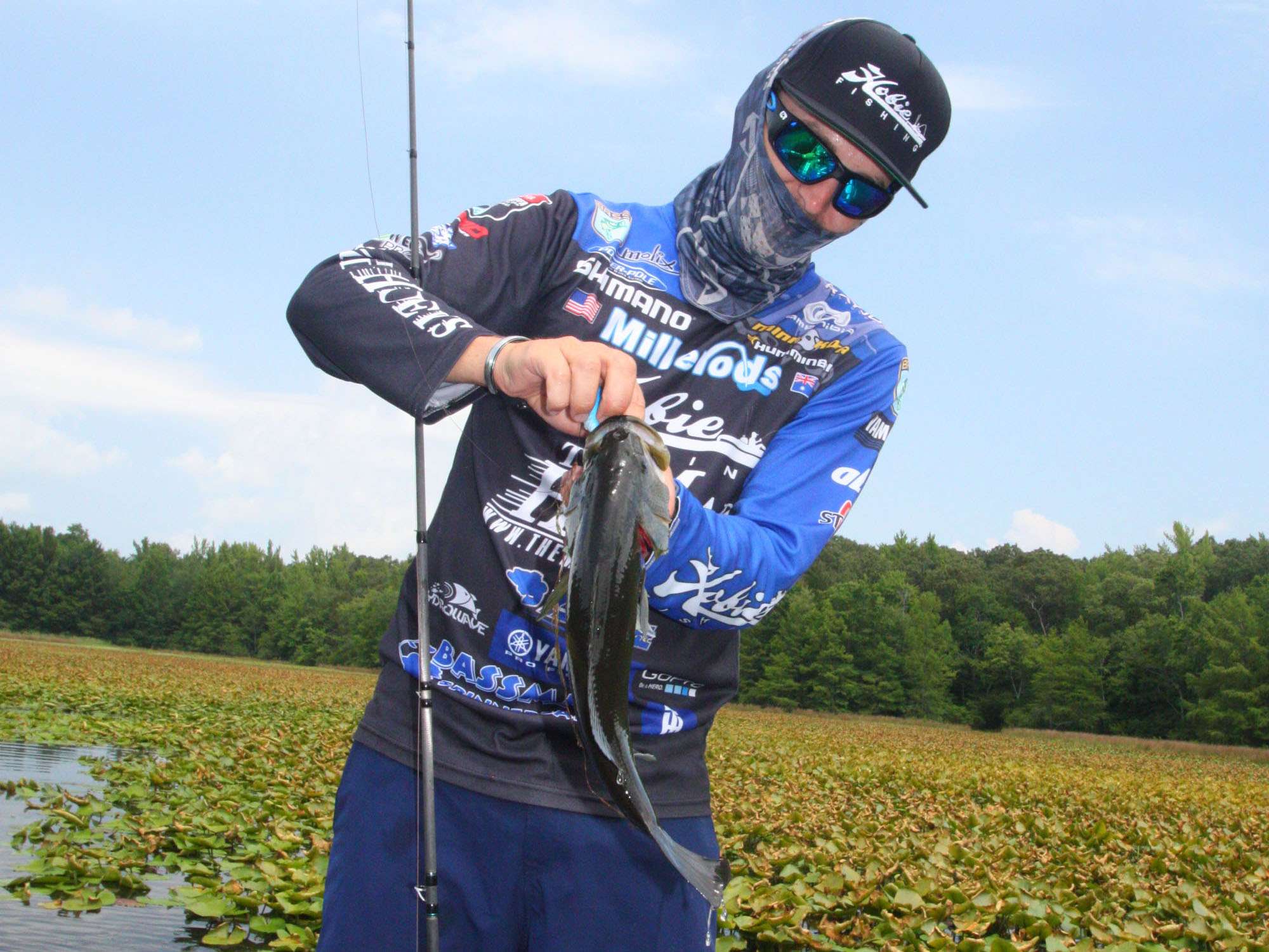<b>1 HOUR LEFT</b><br>
<b>12:48 p.m.</b> Jocumsen follows the ditch into a shallow, pad-choked pocket. He casts the frog to the edge of the pads and catches his third keeper bass, 2 pounds, 2 ounces. 
