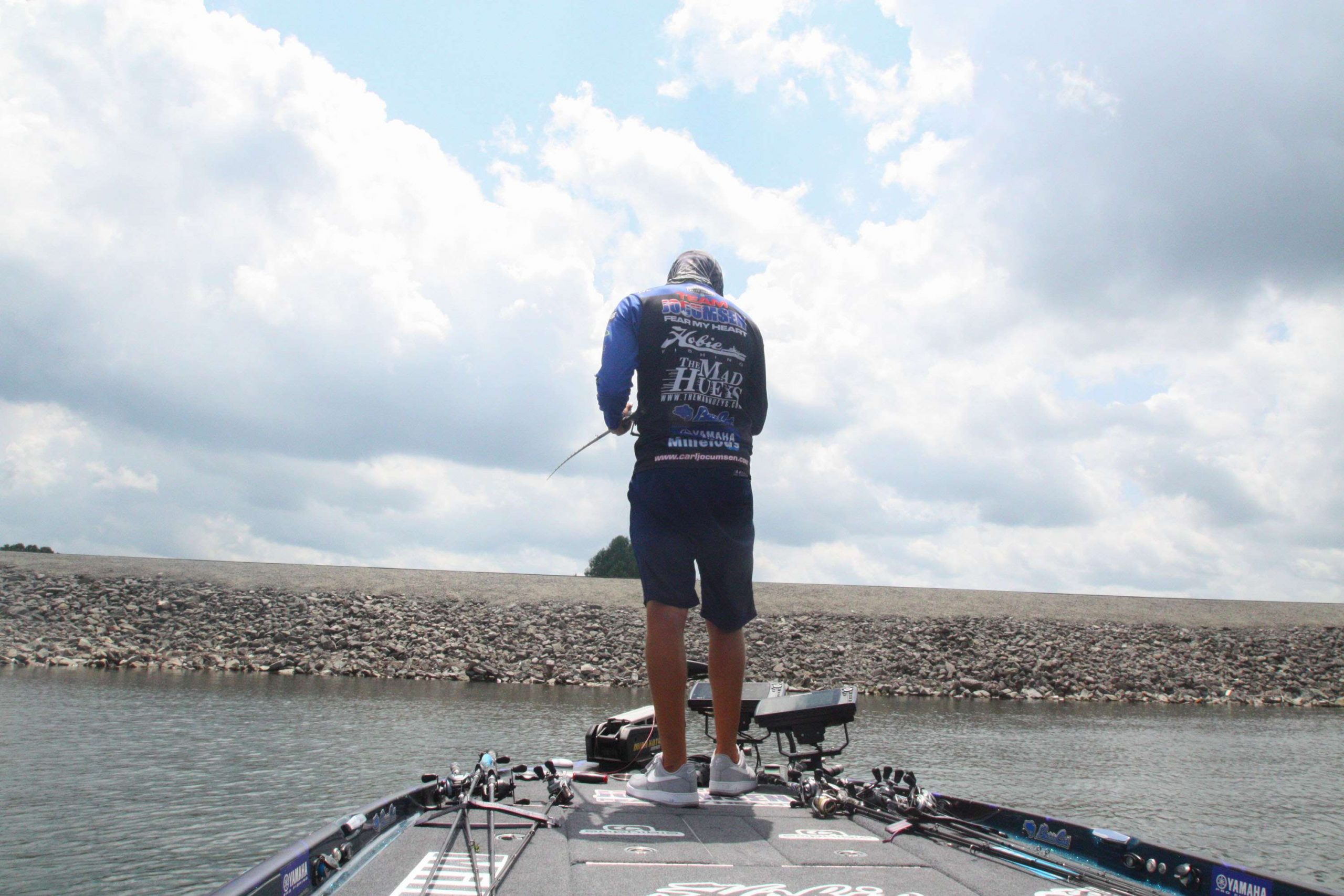 <b>1:10 p.m.</b> Jocumsen races downlake to a main-lake point. He hits it with the swim jig, spinnerbait and Roboworm. <br>
<b>1:17 p.m.</b> Moving farther downlake, Jocumsen probes an offshore rockpile with the Roboworm. âThereâs a load of fish here, but theyâre all suspended.â <br>
<b>1:21 p.m.</b> Jocumsen tries the underspin swimbait off the rockpile. âThis usually works well on suspended fish.â But not today! <br>
<b>1:30 p.m.</b> Jocumsen has returned to Lake Lâs dam and is retrieving an 8-inch Megabass swimbait around the structure. âIâm going for the 12-pounder!â <br>
<b>1:45 p.m.</b> Timeâs up! Jocumsen ends his day on Lake L with three keeper bass totaling 8 pounds, 5 ounces.
<p>
<b>THE DAY IN PERSPECTIVE</b><br>
âI thought I was onto something when I caught that 4-15 out of the pads early, but I couldnât get on any more big fish on that pattern,â Jocumsen told Bassmaster. âI had a lot more bites off deep structure than I did in the pads, but they were mostly from very small fish. Still, I didnât move out deeper until 11 a.m.</b>, so I didnât have much time left to locate more deep places that might have held bigger fish. If I were to fish here tomorrow, Iâd head straight to those tributary pads and hit them hard until the bite tapered off, then Iâd nose around offshore and look for more deep spots instead of rehitting the pad fields that didnât produce for me today.â
<p>
<b>WHERE AND WHEN CARL JOCUMSEN CAUGHT HIS KEEPER BASS</b><br>
1 pound, 4 ounces; blue and white Molix WTD weedless surface rat; lily pads near tributary mouth; 8:07 a.m. <br>
4 pounds, 15 ounces; same lure and place as No. 1; 8:13 a.m. <br>
2 pounds, 2 ounces; same lure as No. 1; lily pads in upper end; 12:48 p.m.<br>
TOTAL: 8 POUNDS, 5 OUNCES