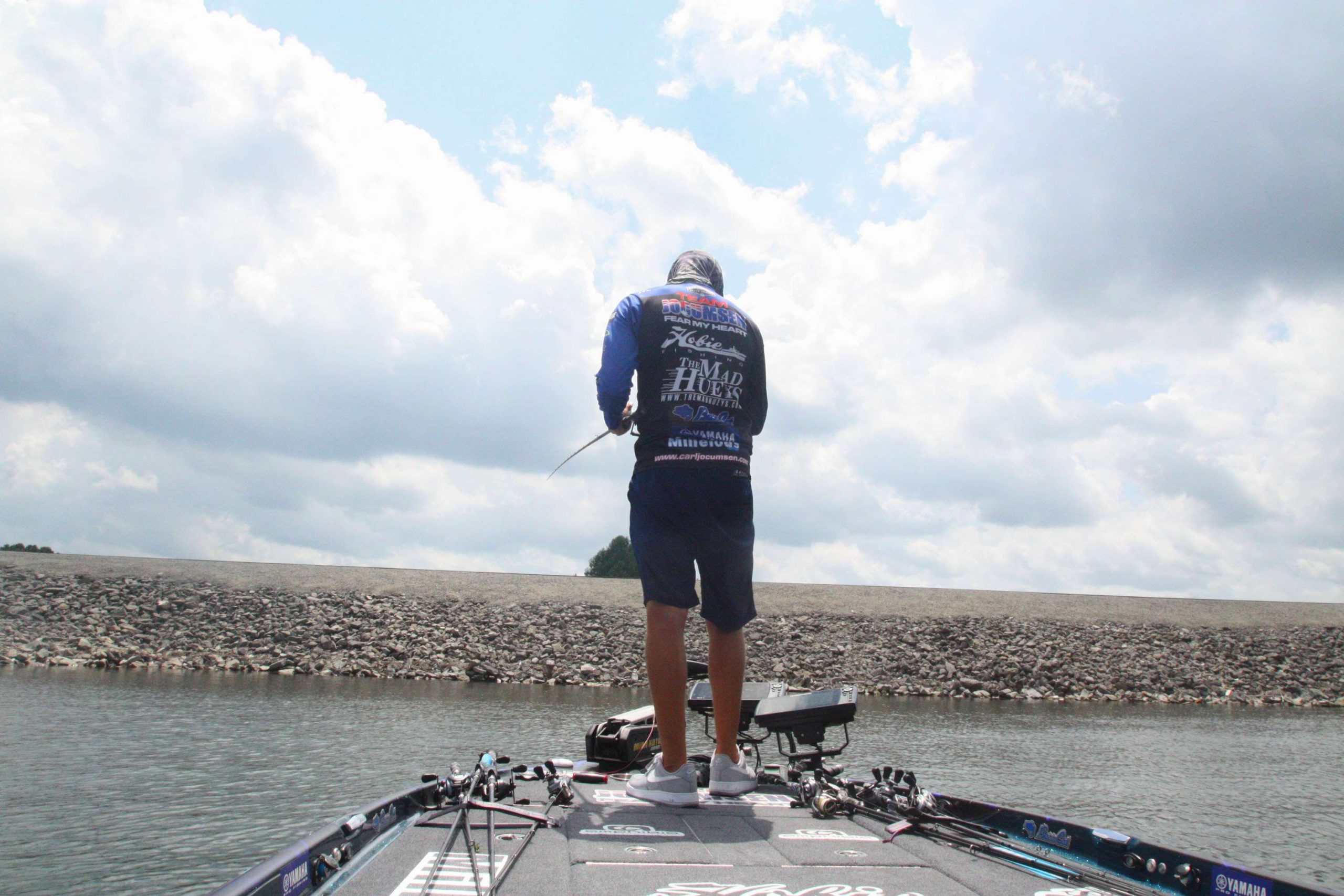 <b>1:10 p.m.</b> Jocumsen races downlake to a main-lake point. He hits it with the swim jig, spinnerbait and Roboworm. <br>
<b>1:17 p.m.</b> Moving farther downlake, Jocumsen probes an offshore rockpile with the Roboworm. âThereâs a load of fish here, but theyâre all suspended.â <br>
<b>1:21 p.m.</b> Jocumsen tries the underspin swimbait off the rockpile. âThis usually works well on suspended fish.â But not today! <br>
<b>1:30 p.m.</b> Jocumsen has returned to Lake Lâs dam and is retrieving an 8-inch Megabass swimbait around the structure. âIâm going for the 12-pounder!â <br>
<b>1:45 p.m.</b> Timeâs up! Jocumsen ends his day on Lake L with three keeper bass totaling 8 pounds, 5 ounces.
<p>
<b>THE DAY IN PERSPECTIVE</b><br>
âI thought I was onto something when I caught that 4-15 out of the pads early, but I couldnât get on any more big fish on that pattern,â Jocumsen told Bassmaster. âI had a lot more bites off deep structure than I did in the pads, but they were mostly from very small fish. Still, I didnât move out deeper until 11 a.m.</b>, so I didnât have much time left to locate more deep places that might have held bigger fish. If I were to fish here tomorrow, Iâd head straight to those tributary pads and hit them hard until the bite tapered off, then Iâd nose around offshore and look for more deep spots instead of rehitting the pad fields that didnât produce for me today.â
 <p>
<b>WHERE AND WHEN CARL JOCUMSEN CAUGHT HIS KEEPER BASS</b><br>
1 pound, 4 ounces; blue and white Molix WTD weedless surface rat; lily pads near tributary mouth; 8:07 a.m. <br>
4 pounds, 15 ounces; same lure and place as No. 1; 8:13 a.m. <br>
2 pounds, 2 ounces; same lure as No. 1; lily pads in upper end; 12:48 p.m.<br>
TOTAL: 8 POUNDS, 5 OUNCES
