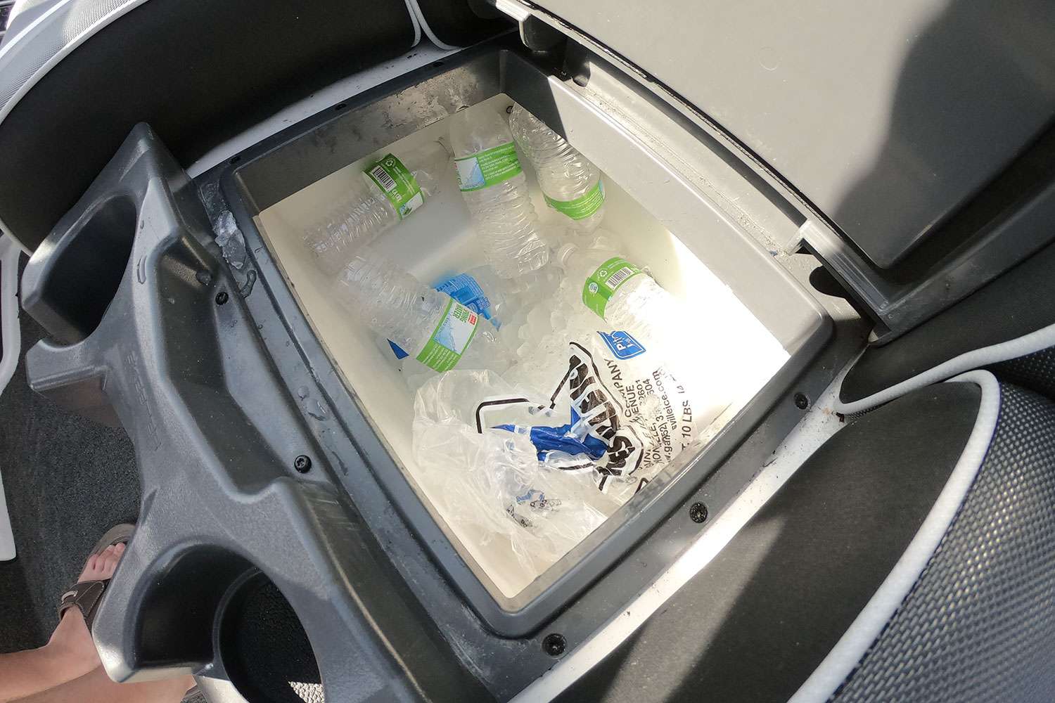 His cockpit console holds his cooler, which is full of cold drinks and food. 
