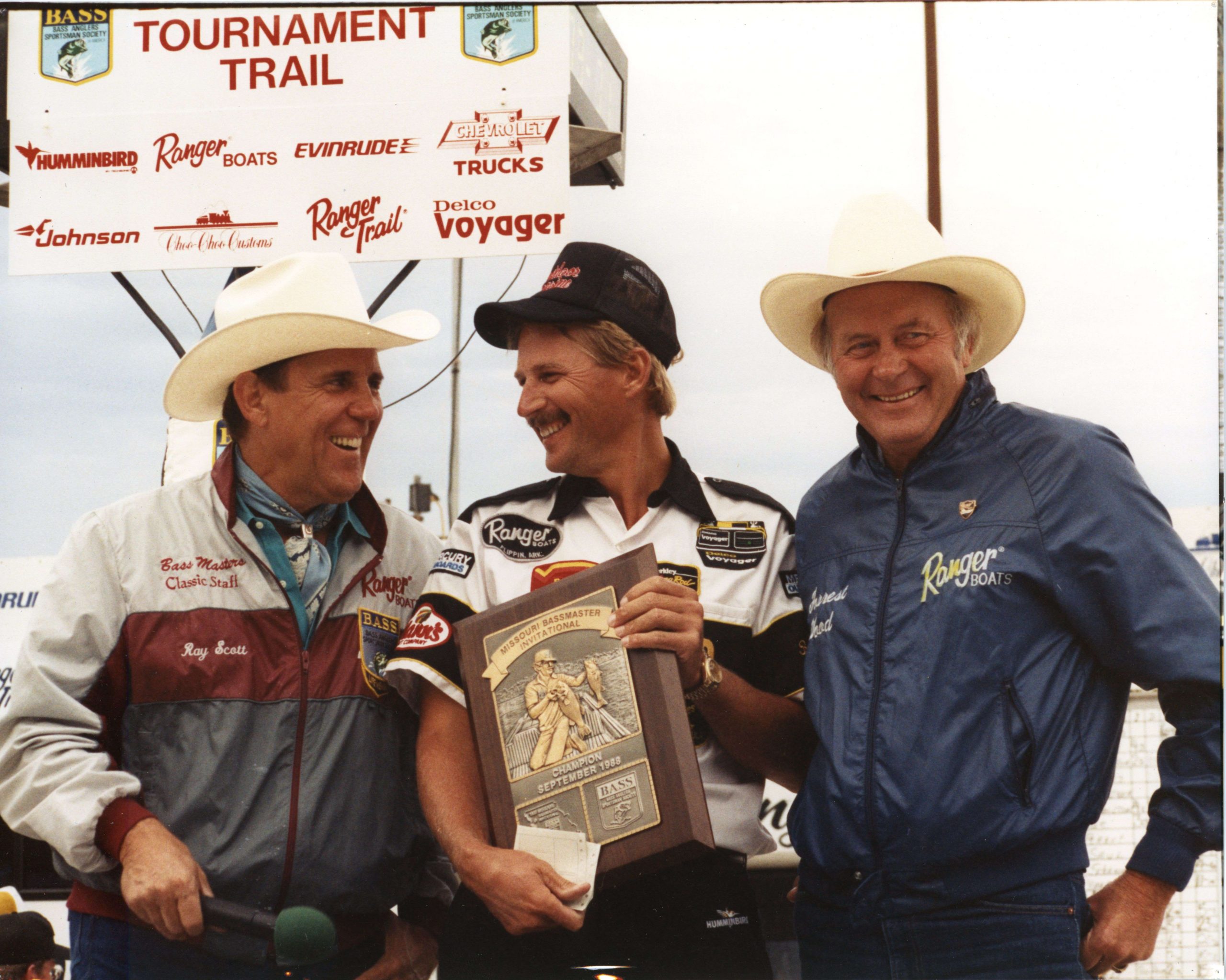 Wood and his wife Nina both attended the tournaments. Part of what they enjoyed the most was visiting with the anglers. Here, Wood poses with Ray Scott and Hank Parker, winner of the 1988 Missouri Invitational. 
