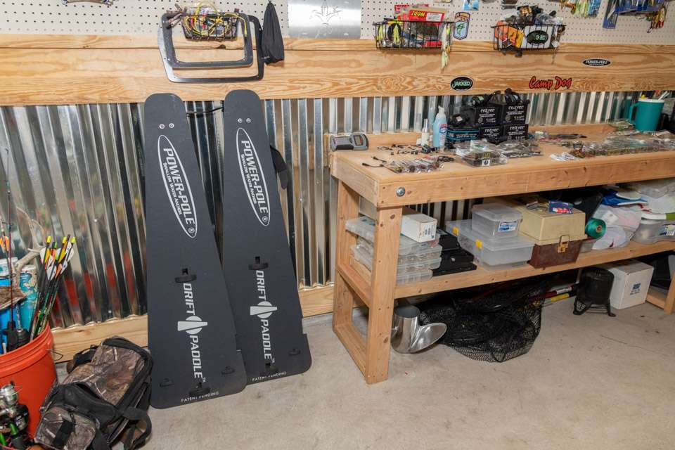 Power-Pole drift paddles are among the fishing tools kept handy in Carriereâs man cave.