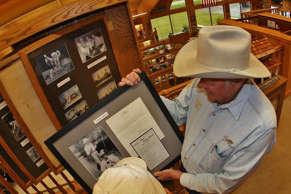 Wood shows off a photo of the early days, including memorabilia from his Forrest L. Wood Guide Service. He employed a number of guides, who in the offseason he kept busy with odd jobs and building more of the 20-foot wooden john boats used to take clients out on the White River.