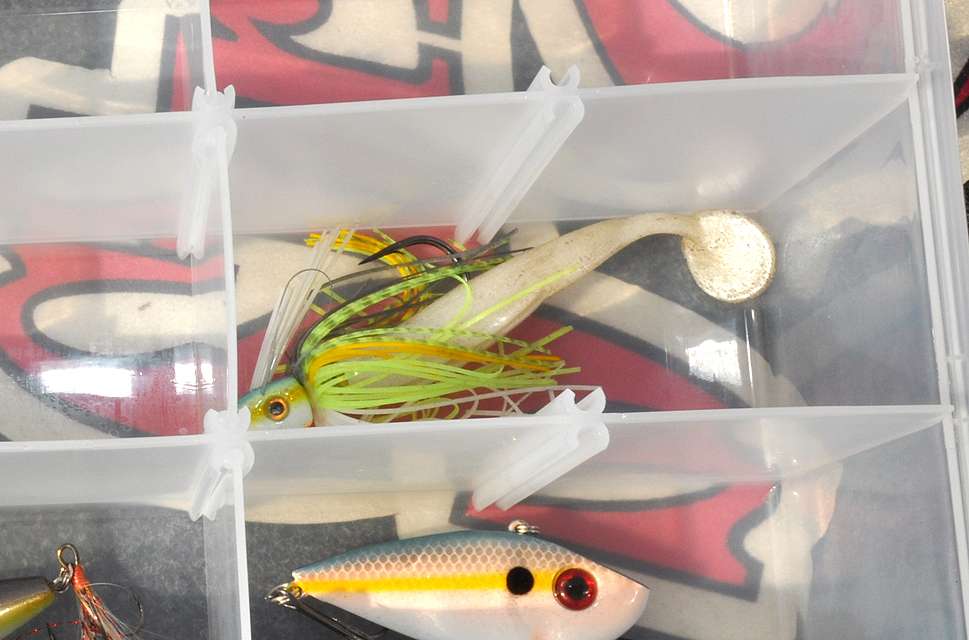 The swim jig, another essential bait, joins the others in the box.