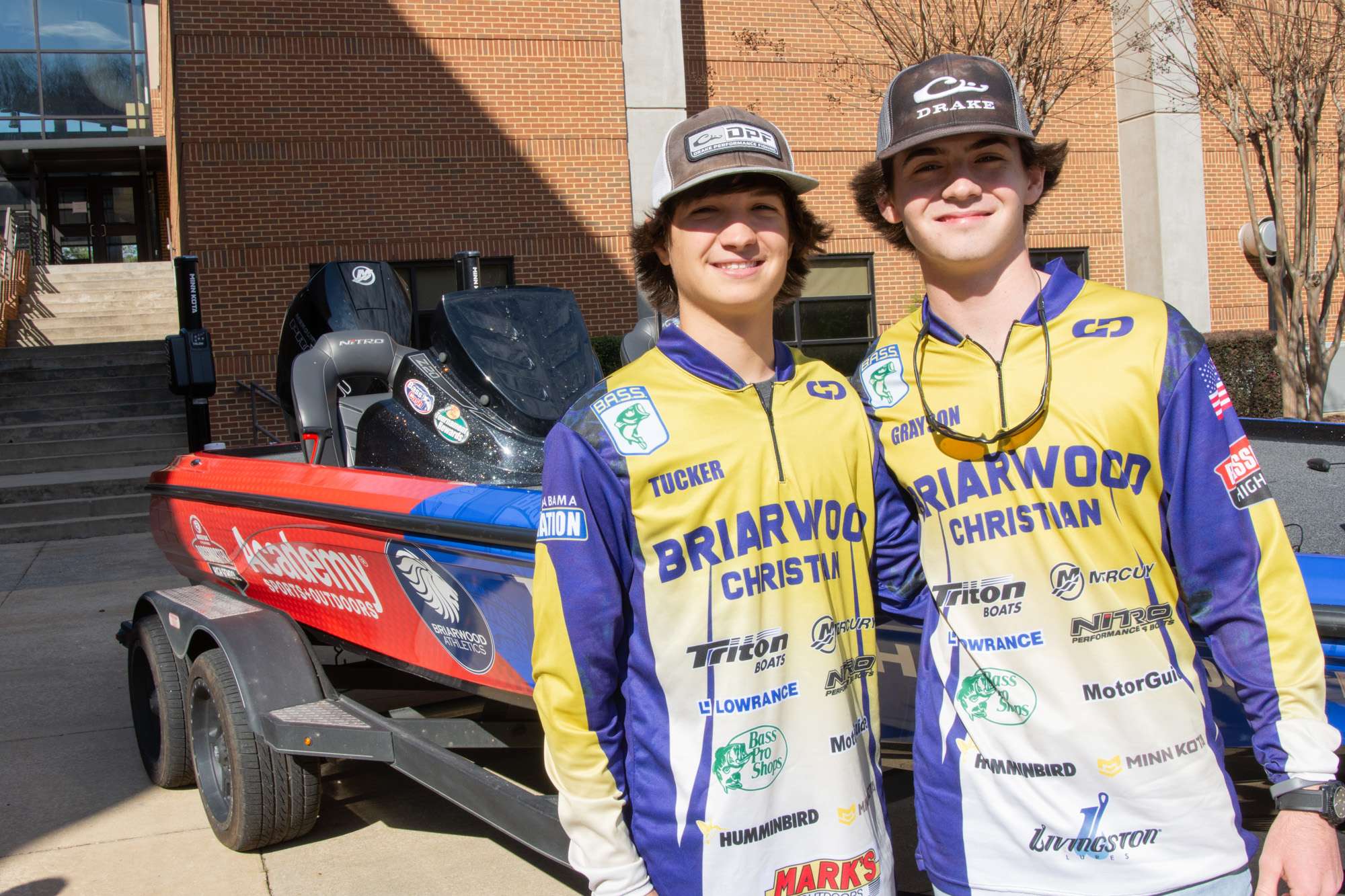 Tucker and Grayson stand in front of their newly wrapped boat, which they will have the opportunity to show off at the 2020 Academy Sports + Outdoors Bassmaster Classic in March!
