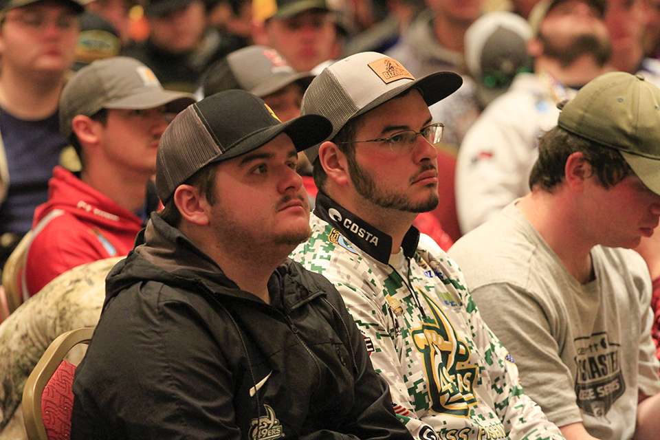 Chris Carnes and Noah Shaver of UNC Charlotte listen in for the rules.