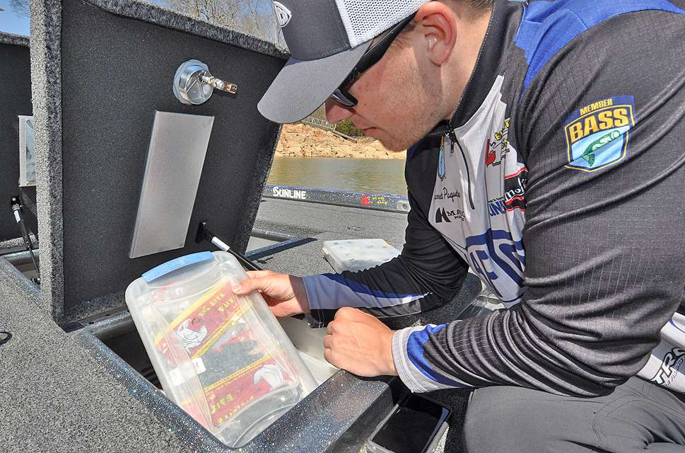 Paquette pulls another box from the boat locker in search of a trailer for the jig.