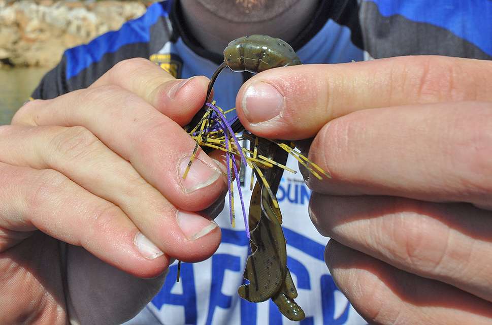 Then he threads the craw onto the hook of the Molix MF Jig.