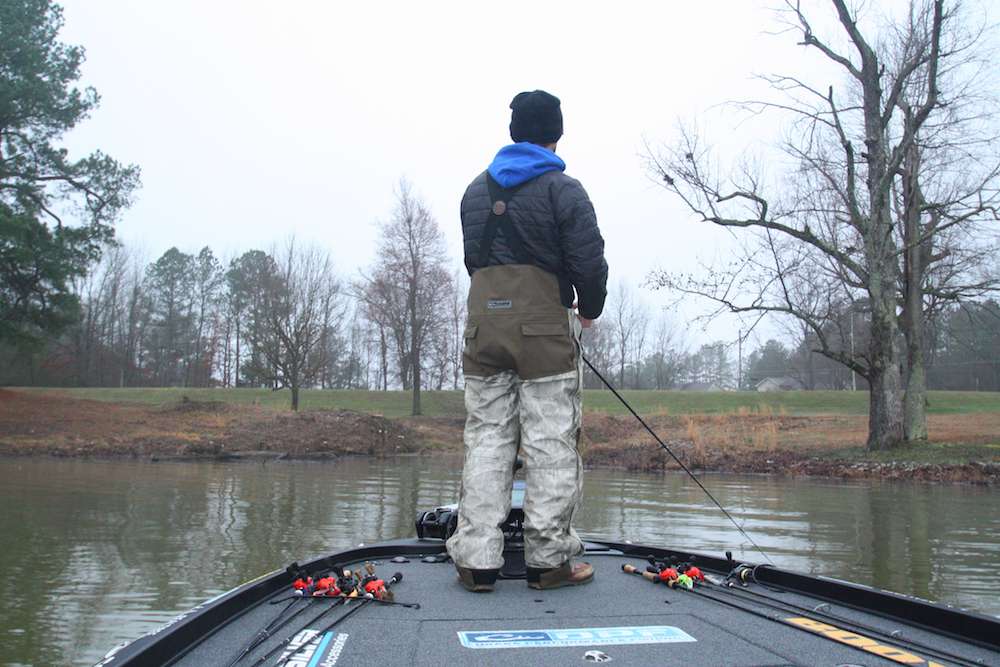 <b>7:35 a.m.</b> Blaylock enters a shallow cove and makes his first casts of the day to shoreline rocks with a 3/Â­8-ounce War Eagle spinnerbait, chartreuse and white with two Colorado blades; the smaller blade is hot orange. <br>
<b>7:42 a.m.</b> Blaylock probes a Â­10-foot ridge at the coveâs mouth with a dark green Â­5-inch Yum Dinger worm on a 3/Â­16-ounce shaky head. âIâm betting the bass will be bunched up tight in these conditions rather than roaming around. Iâd much rather catch a bunch of fish off one spot than run around the lake in this cold rain!â <br>
<b>7:50 a.m.</b> He tries a 1/2-ounce brown craw Booyah football jig with a Yum craw chunk on the ridge. <br>
<b>7:54 a.m.</b> Blaylock casts the spinnerbait to a seawall. âI like that little orange blade in cold, murky water. Choosing the right lure color in low-light conditions is tricky; you want âem to see it, but you donât want it to look totally unnatural.â
