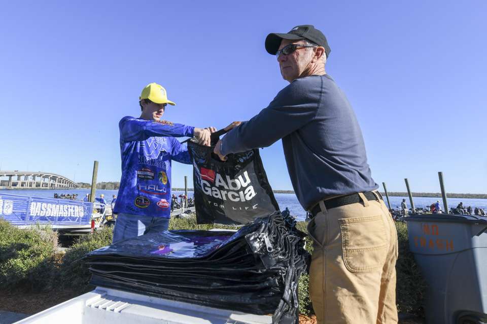 Team members also worked with Bassmaster weigh-in staff collect bags.