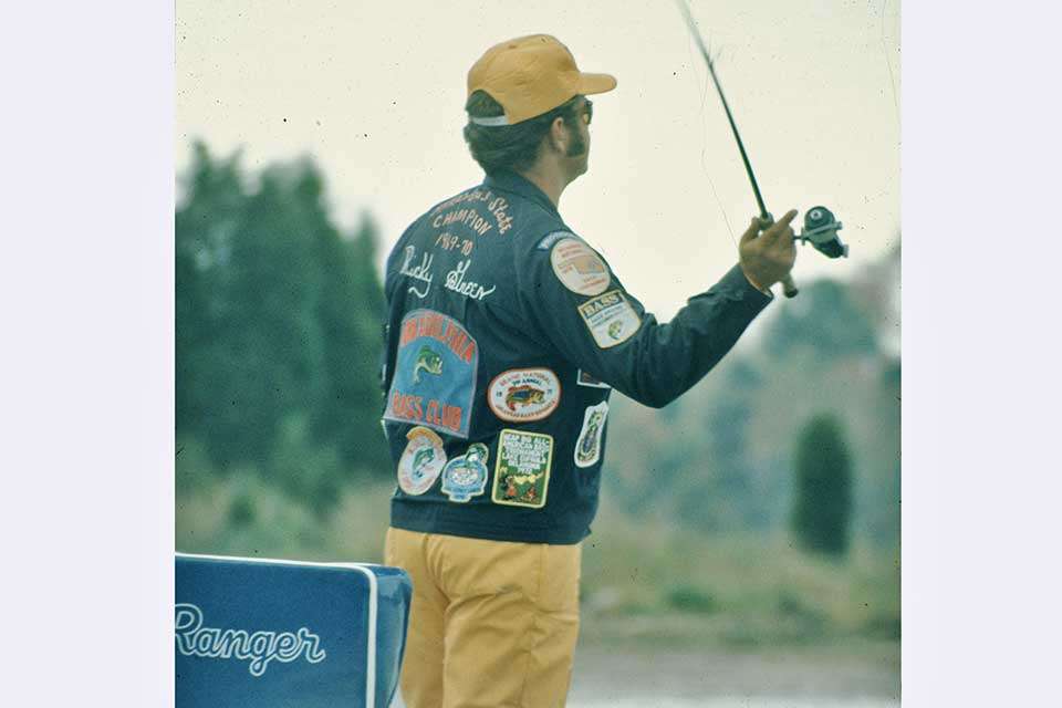 Ricky Green wears an example of the times in 1973. His jacket has his name along with embroidery of âArkansas State Championâ as well as a huge patch from the Arkadelphis Bass Club, other various tournament patches and of course, the B.A.S.S. patch.