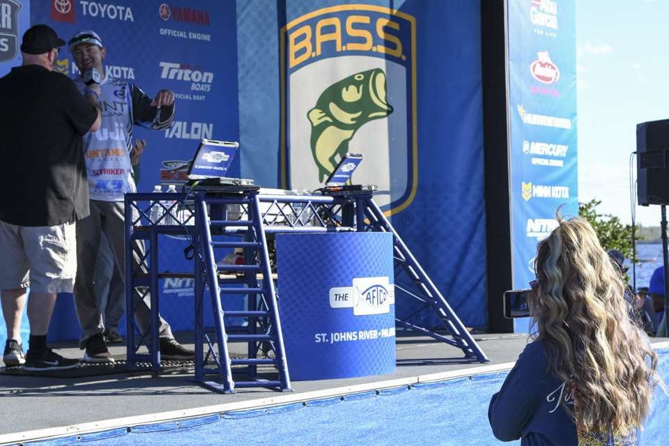 As her husband talked about his day on the water with tournament emcee Dave Mercer, Hunter Welcher stood in front of the crowd documenting the moment and crying.