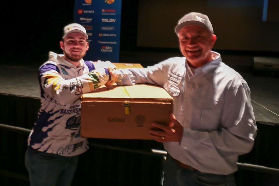 Johnson Outdoors' Bill Carlson presented a MinnKota Ultrex to a lucky angler, Kyle Dillon.  Kyle won a random drawing for it at registration.