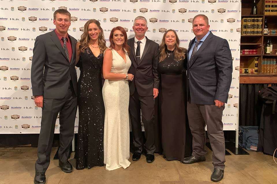 At the Night of Champions Wednesday, anglers and wives (from left) Grae and Jessica Buck, Darold and Randi Gleason and Whitney and Samantha Stephens pose at B&A Warehouse, an events center in a 122-year-old building. 