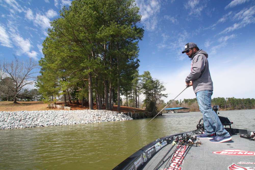 <b>12:23 p.m.</b> Groh has fished his way out of the cove and is now cranking a patch of riprap with the orange squarebill. The lure remains unmolested by any fish. âHey Mr. Bassmaster writer, bass are supposed to be on rock in March, right?â <br>
<b>12:31 p.m.</b> Groh runs uplake to crank the War Pig across a shallow point. <br>
<b>12:43 p.m.</b> Groh has run back to the mud flat where he caught his sole keeper earlier and is combing the structure with the War Pig. No more takers here. <br>
<b>12:56 p.m.</b> Groh races across the lake to a seawall he fished earlier and hammers it with the lipless crankbait and squarebill. Still nothing.
<p>
<b>1 HOUR LEFT</b><br>
<b>1:07 p.m.</b> Groh roars back to the clay point where he lost the 5-pounder and snags a foot-long gizzard shad on the War Pig. âBig fish, wrong species!â <br>
<b>1:13 p.m.</b> Groh blasts uplake as far as he can go and begins cranking the orange squarebill around shallow laydowns. âThereâs a ton of wood cover up here. Hopefully, some bass, too.â <br>
<b>1:19 p.m.</b> Groh tries the spinnerbait around a sloping bank with wood and rock cover.
<b>1:25 p.m.</b> He rakes a shallow sandbar with the War Pig. <br>
<b>1:31 p.m.</b> Groh slow rolls the spinnerbait down a laydown tree and catches a 10-inch largemouth. âMean little bastard! That was the hardest strike Iâve had all day!â