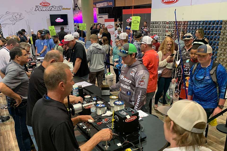 At the Berkley booth, a crew is busy spooling line for anybody who purchased a reel. Say, thatâs some line.