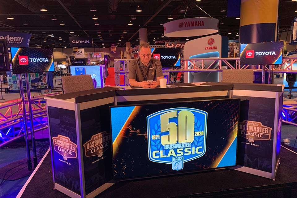Early on Championship Sunday, Bassmaster TV producer Mike McKinnis takes a prime seat on the B.A.S.S. set and does some work before heading to the production truck for a day of LIVE.