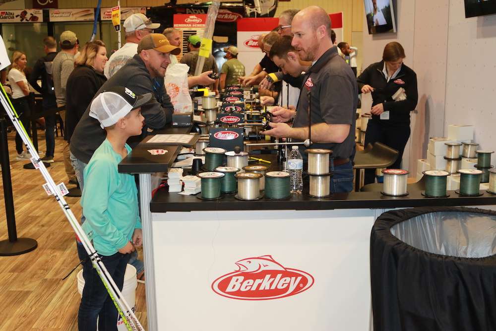 This young angler eagerly watches as Berkley experts provide free line spooling.
